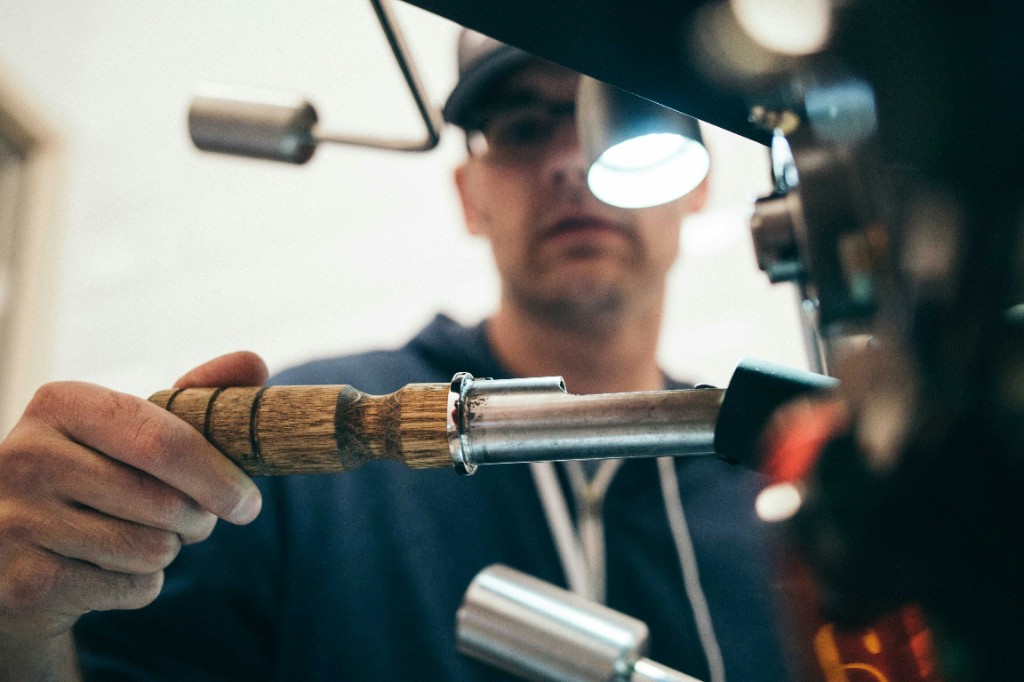 Apex Plumbing technician inspecting pipe connections